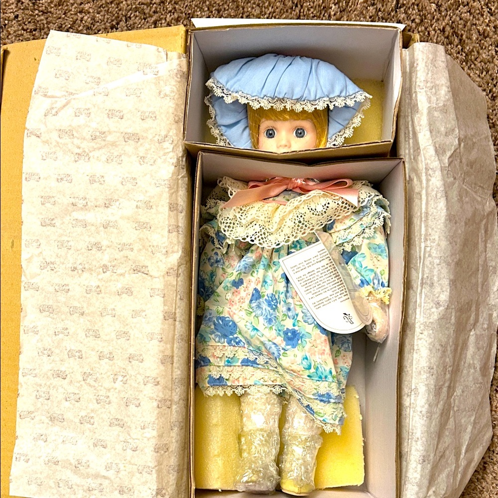 Prinston Gallery certifies the porceline doll with box, stand and certificate